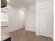 Hallway featuring wood floors, neutral paint, and an open doorway to another room at 770 Grove Bnd, Decatur, GA 30030