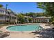 Community swimming pool with lounge chairs and a covered pavilion at 770 Grove Bnd, Decatur, GA 30030