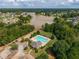 Community pool and clubhouse view, with a lake in the background at 816 Graeme Dr, Mcdonough, GA 30252