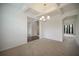 Formal dining room with neutral decor and chandelier at 816 Graeme Dr, Mcdonough, GA 30252