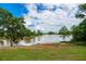 Serene lake view with lush greenery and a tranquil atmosphere at 816 Graeme Dr, Mcdonough, GA 30252