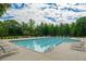 Community lap pool with multiple lounge chairs and a surrounding area at 816 Graeme Dr, Mcdonough, GA 30252