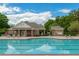 Community pool with lounge chairs and a clubhouse, great for summer fun at 816 Graeme Dr, Mcdonough, GA 30252