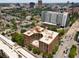 Aerial view of a residential building in a city setting with surrounding buildings at 115 W Peachtree Nw # 704, Atlanta, GA 30313