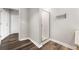 Modern bathroom with glass shower and dark wood floors at 115 W Peachtree Nw # 704, Atlanta, GA 30313