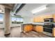 Modern kitchen with stainless steel appliances and wood cabinets at 115 W Peachtree Nw # 704, Atlanta, GA 30313