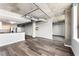 Open concept living area with hardwood floors and exposed ductwork at 115 W Peachtree Nw # 704, Atlanta, GA 30313