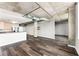 Open living space with hardwood floors and exposed beams at 115 W Peachtree Nw # 704, Atlanta, GA 30313