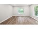 Bright and airy basement bedroom with vinyl flooring and a window offering natural light at 1590 Highland Farm Dr, Suwanee, GA 30024