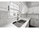 White kitchen with stainless steel sink and faucet at 1590 Highland Farm Dr, Suwanee, GA 30024