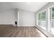 Bright living room with fireplace and large windows at 1590 Highland Farm Dr, Suwanee, GA 30024