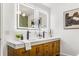 Double vanity bathroom with modern light fixtures and quartz countertop at 2019 Emerald Dr, Jonesboro, GA 30236