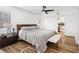 Comfortable bedroom featuring a ceiling fan, wood floors, and a serene color scheme at 2201 Cumberland Se Ct, Smyrna, GA 30080