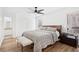 Comfortable bedroom featuring a ceiling fan, wood floors, and a serene color scheme at 2201 Cumberland Se Ct, Smyrna, GA 30080