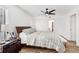 Comfortable bedroom featuring a ceiling fan, wood floors, and a serene color scheme at 2201 Cumberland Se Ct, Smyrna, GA 30080