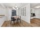 Bright dining area features a modern chandelier, wood floors, and plenty of natural light at 2201 Cumberland Se Ct, Smyrna, GA 30080