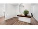 Inviting entryway featuring wood floors, modern console table, and neutral paint at 2201 Cumberland Se Ct, Smyrna, GA 30080