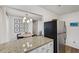 Open kitchen view to the dining area and featuring stainless steel refrigerator at 2201 Cumberland Se Ct, Smyrna, GA 30080