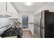 Compact kitchen featuring stainless steel appliances, granite countertops, and natural light at 2201 Cumberland Se Ct, Smyrna, GA 30080