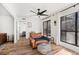 Comfortable living room with ceiling fan, view of the back patio, and hardwood floors at 2201 Cumberland Se Ct, Smyrna, GA 30080