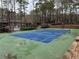 Community tennis court with surrounding trees at 2201 Cumberland Se Ct, Smyrna, GA 30080