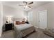 Bedroom with queen bed, ceiling fan, and window with plantation shutters at 3939 Glenview Club Ln, Duluth, GA 30097