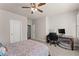 Bedroom with a queen bed, ceiling fan, and home office area at 3939 Glenview Club Ln, Duluth, GA 30097