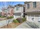 Townhome with gray and brick exterior and a 2-car garage at 3939 Glenview Club Ln, Duluth, GA 30097