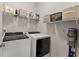 Laundry room with washer, dryer, and ample shelving at 3939 Glenview Club Ln, Duluth, GA 30097