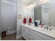 Elegant bathroom with double vanity, white cabinets, and a separate toilet area at 62 Emerson Hill Sq, Marietta, GA 30060