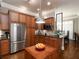 Modern kitchen with stainless steel appliances and wood cabinetry at 62 Emerson Hill Sq, Marietta, GA 30060