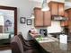 Kitchen breakfast bar with granite countertop and seating for three at 62 Emerson Hill Sq, Marietta, GA 30060