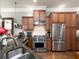 Modern kitchen with stainless steel appliances and wood cabinetry at 62 Emerson Hill Sq, Marietta, GA 30060