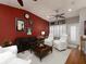 Relaxing living room with white armchairs, brown sofa, and a decorative red wall at 62 Emerson Hill Sq, Marietta, GA 30060