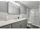 Updated bathroom with gray vanity, subway tile, and a shower at 868 E Ponce De Leon Ave, Decatur, GA 30030