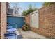 Charming brick patio, complete with a blue door and storage at 868 E Ponce De Leon Ave, Decatur, GA 30030