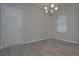 Bright dining room with hardwood floors and chandelier at 471 Charleston Pl, Villa Rica, GA 30180