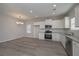 Modern kitchen featuring white cabinets and stainless steel appliances at 471 Charleston Pl, Villa Rica, GA 30180