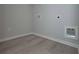 Laundry room with vinyl flooring and built-in shelving at 471 Charleston Pl, Villa Rica, GA 30180