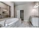 Spa-like bathroom with soaking tub, walk-in shower, and large vanity at 121 Frontier Way, Mcdonough, GA 30253