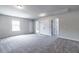 Spacious bonus room with grey carpet and multiple closets at 121 Frontier Way, Mcdonough, GA 30253