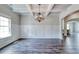 Formal dining room with hardwood floors, wainscoting, and a chandelier at 121 Frontier Way, Mcdonough, GA 30253