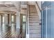 Two-story foyer with hardwood floors and a view into the living areas at 121 Frontier Way, Mcdonough, GA 30253