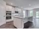 Modern kitchen with white cabinets, granite countertops, and stainless steel appliances at 121 Frontier Way, Mcdonough, GA 30253
