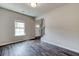 Bright living room with hardwood floors and a view of the entryway at 121 Frontier Way, Mcdonough, GA 30253
