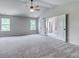 Main bedroom with vaulted ceiling, ceiling fan, and en-suite bathroom at 121 Frontier Way, Mcdonough, GA 30253