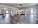 Open floor plan with hardwood floors and a view of the kitchen and dining areas at 121 Frontier Way, Mcdonough, GA 30253
