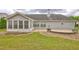 Spacious backyard with patio, landscaping, and exterior lighting at 160 Valley Brook Dr, Covington, GA 30016