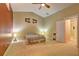 Bright bedroom with carpeted floor, ceiling fan and access to bathroom at 160 Valley Brook Dr, Covington, GA 30016