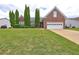 Brick ranch home with attached garage and landscaped lawn at 160 Valley Brook Dr, Covington, GA 30016